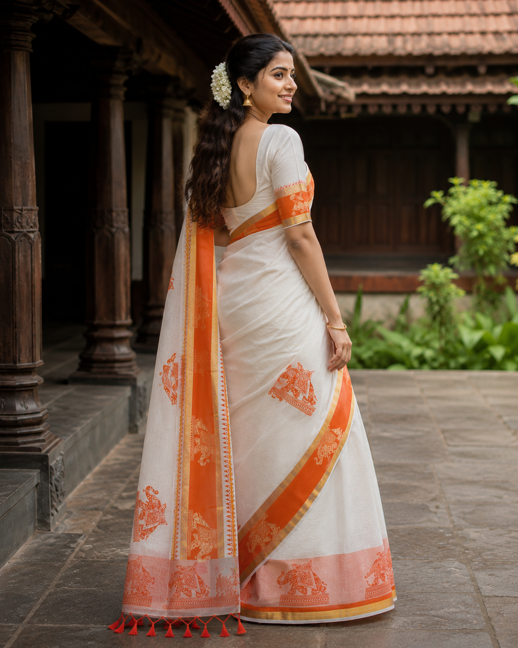 Elegant Kerala Tissue Saree with Orange Border and Elephant Print Design